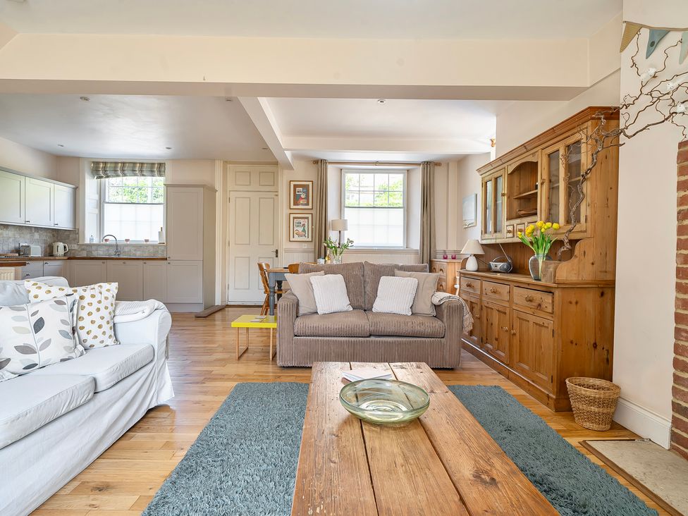 A living room with a sofa and coffee table at East Wing in Crewkerne