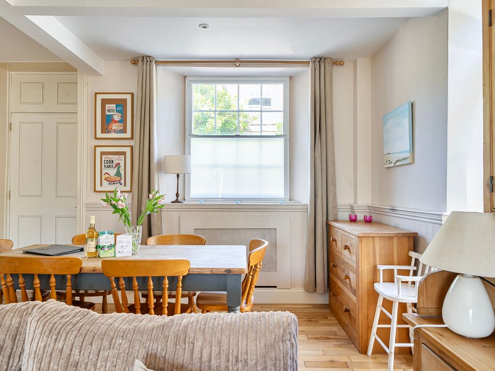 A dining room with a table and chairs at East Wing in Crewkerne