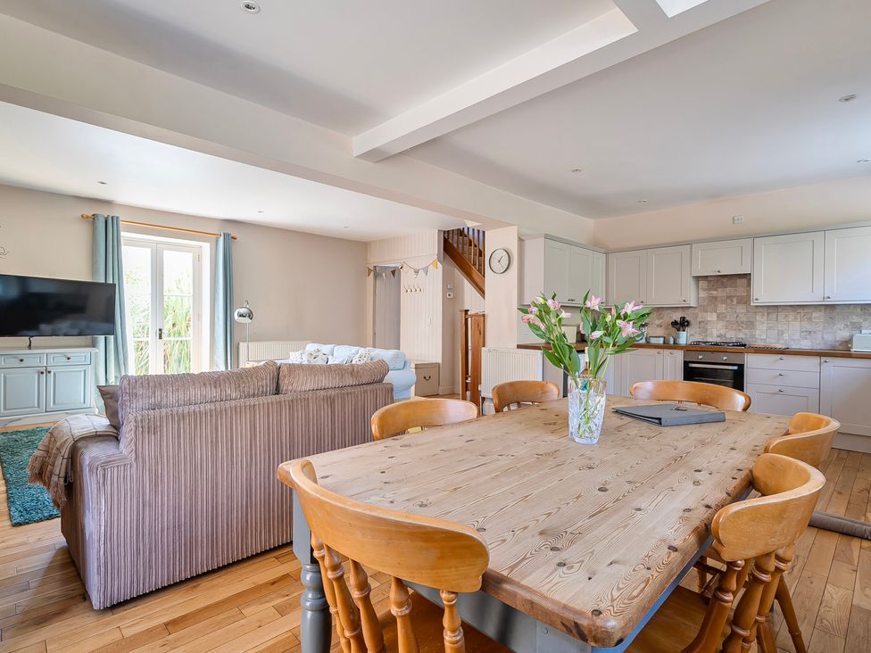 A dining room with a table and chairs at East Wing in Crewkerne