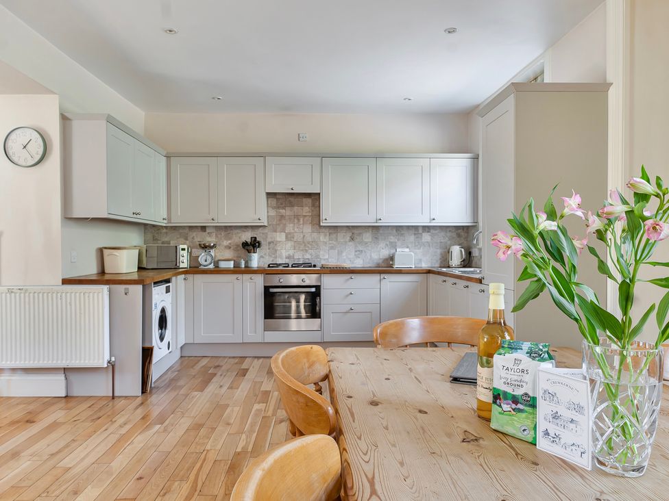 A kitchen with a table and chairs at East Wing in Crewkerne
