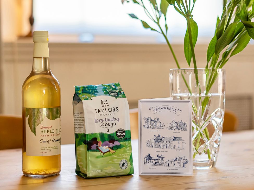 A kitchen with apple juice, coffee, and a greeting card at East Wing Crewkerne