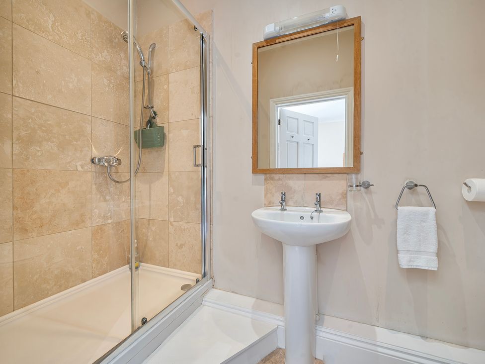 A bathroom with a shower and sink at East Wing in Crewkerne