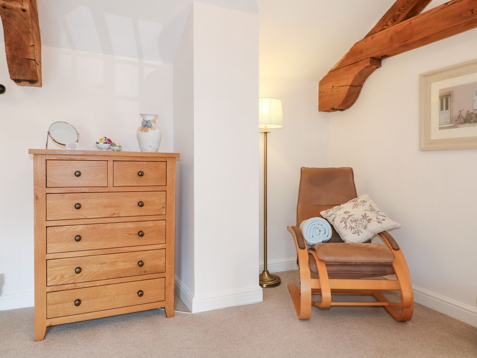 A snug with a dresser and rocking chair at The Dairy Eastwood