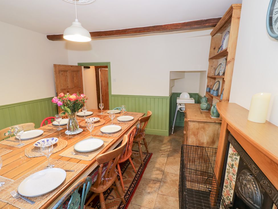 A dining room with a table set for a meal at Town Mill in Bewdley