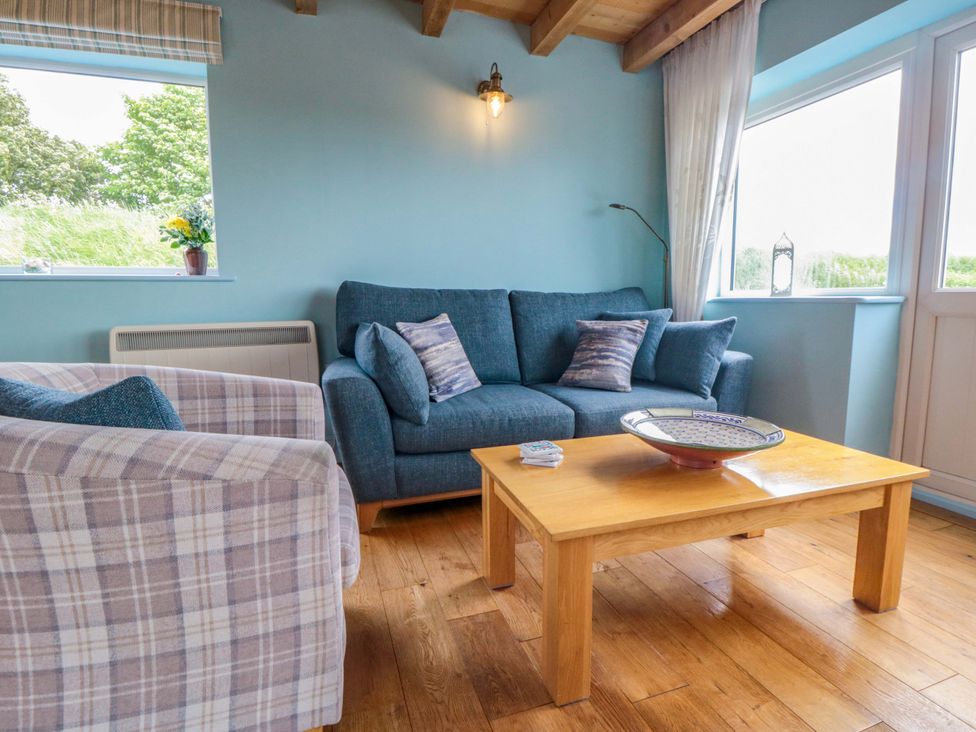 A living room with a sofa and coffee table at Field Cottage in Staithes