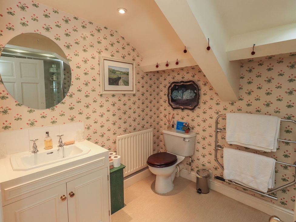 A bathroom with a sink and toilet at The Garden Rooms Lawkland in Austwick