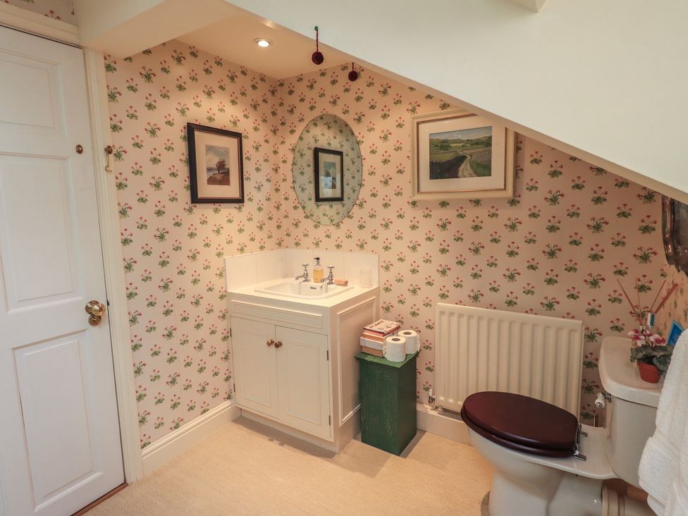 A bathroom with sink and toilet at The Garden Rooms Lawkland Austwick