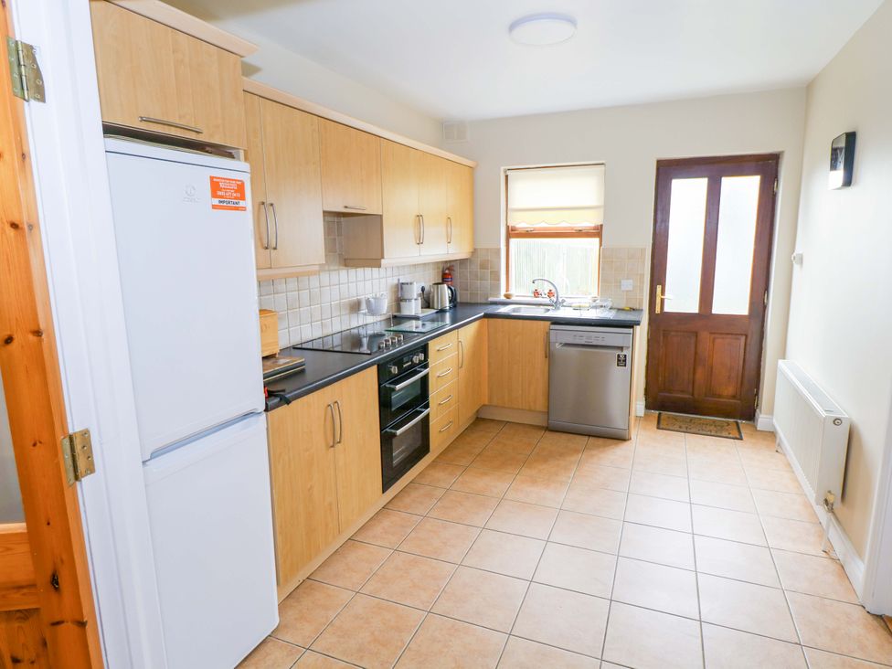 A kitchen with appliances and cabinets at Aisling in Foxford near Ballina, County Mayo
