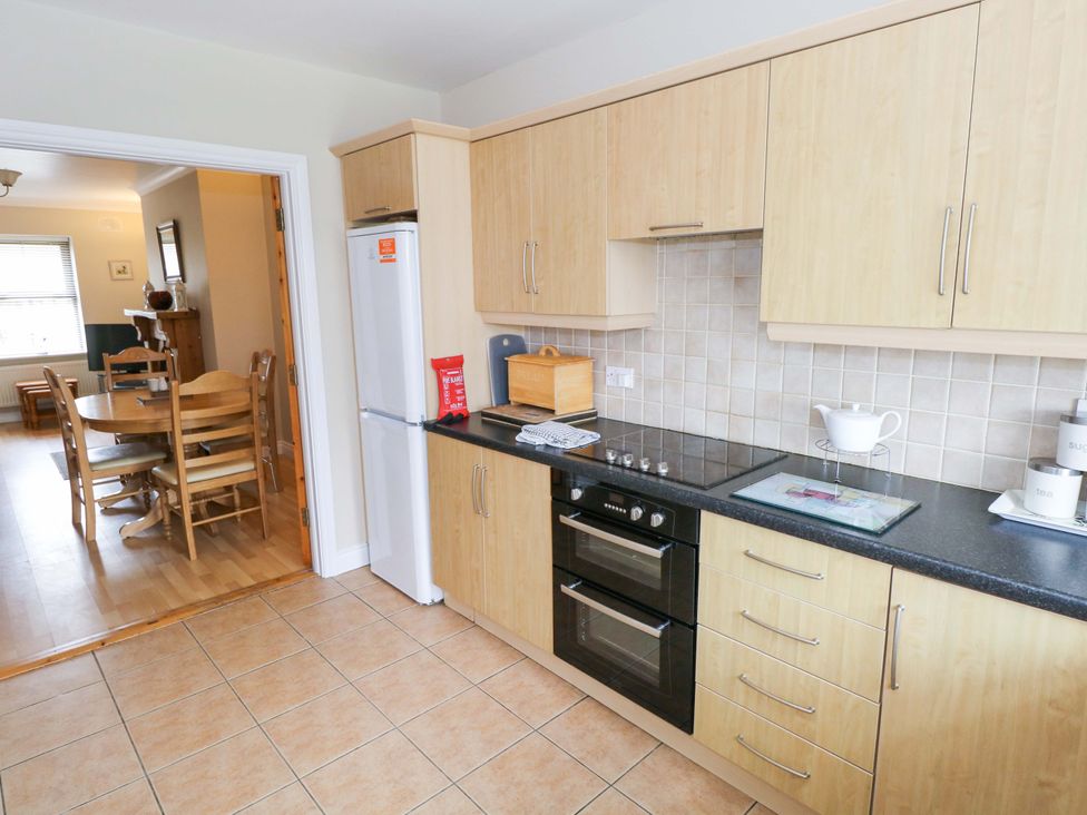 A kitchen with cabinets and appliances at Aisling Foxford near Ballina County Mayo