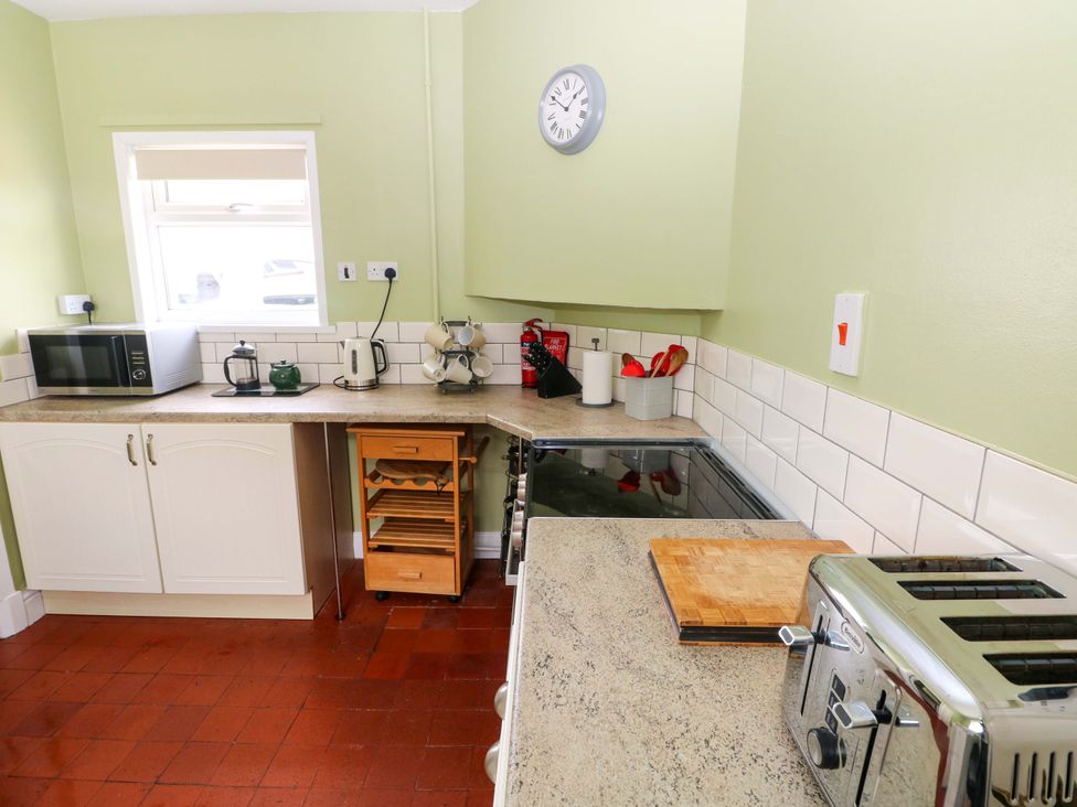 A kitchen with appliances on the counter at White Thorns in Haverfordwest