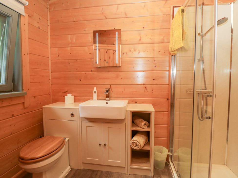 A bathroom with a sink and shower at Elm Lodge in Ulverston