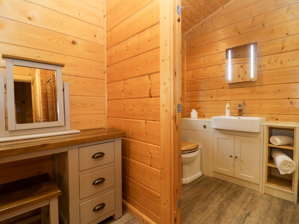 A bathroom with a vanity and washbasin at Elm Lodge in Ulverston