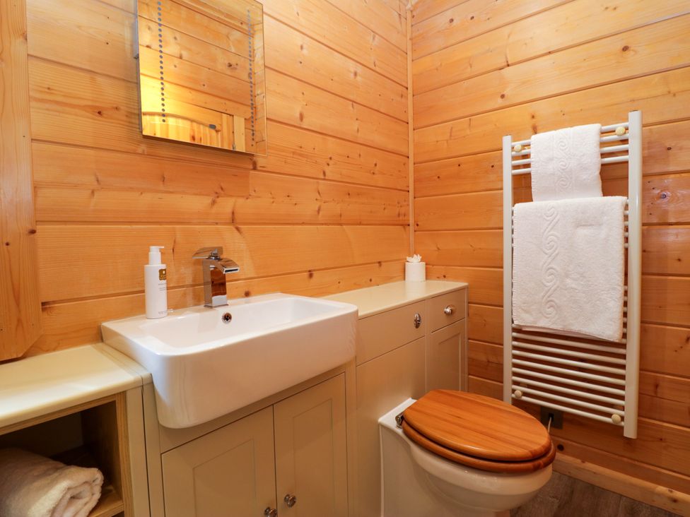 A bathroom with sink and toilet at Elm Lodge in Ulverston