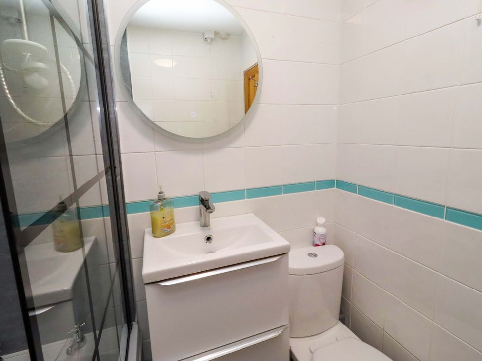 A bathroom with a sink and toilet at Sunrise Cottage in Beadnell