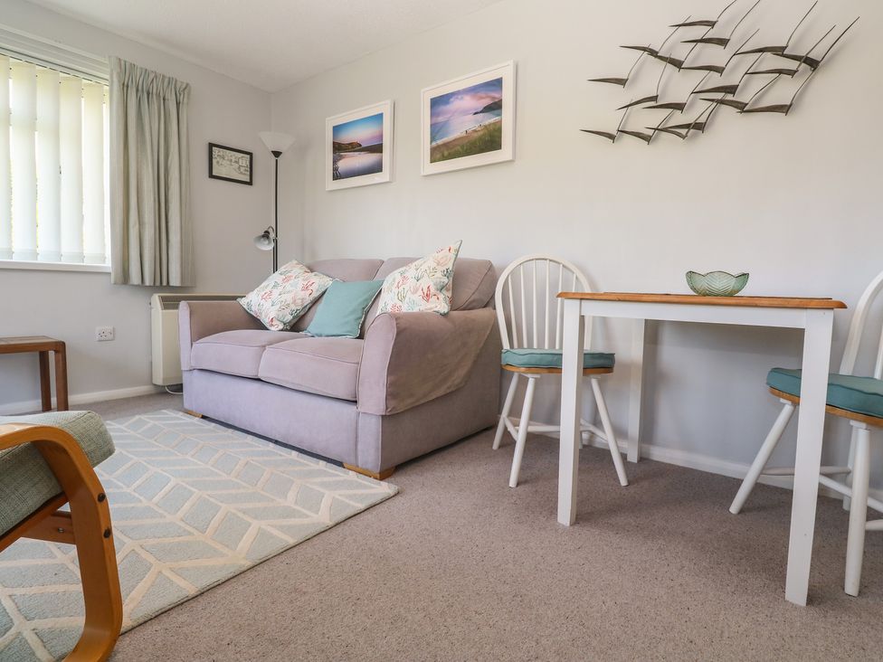 A living room with a sofa and table at Bre An Mor in Praa Sands