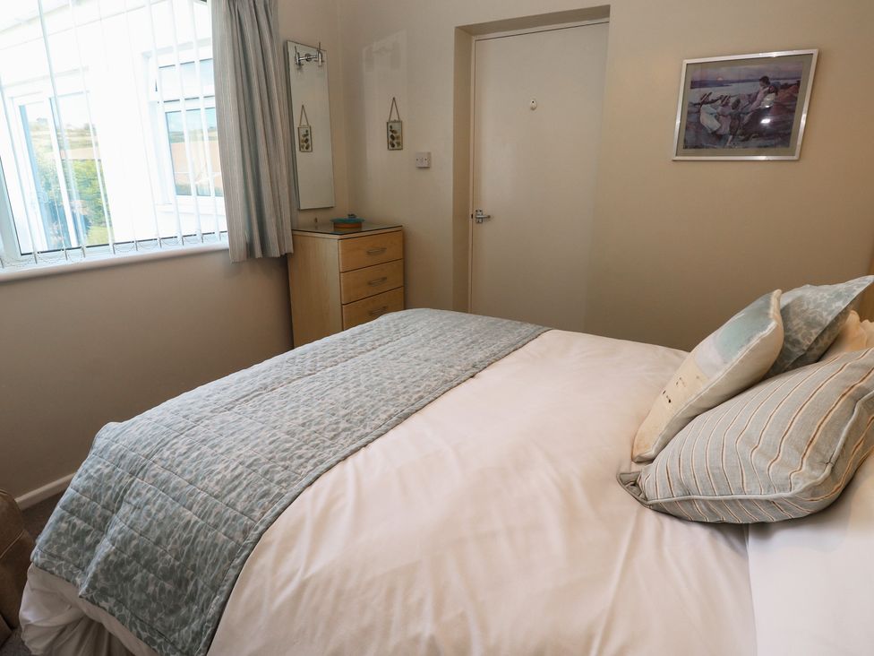 A bedroom with a bed and drawer unit at Bre An Mor in Praa Sands