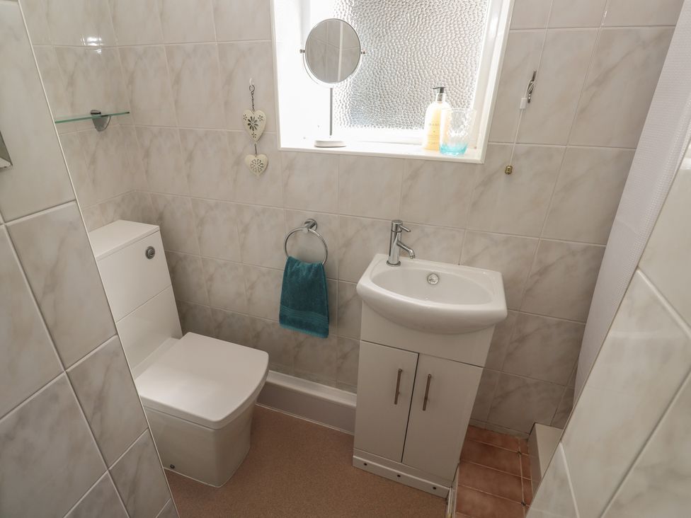 A bathroom with a toilet and sink at Bre An Mor in Praa Sands