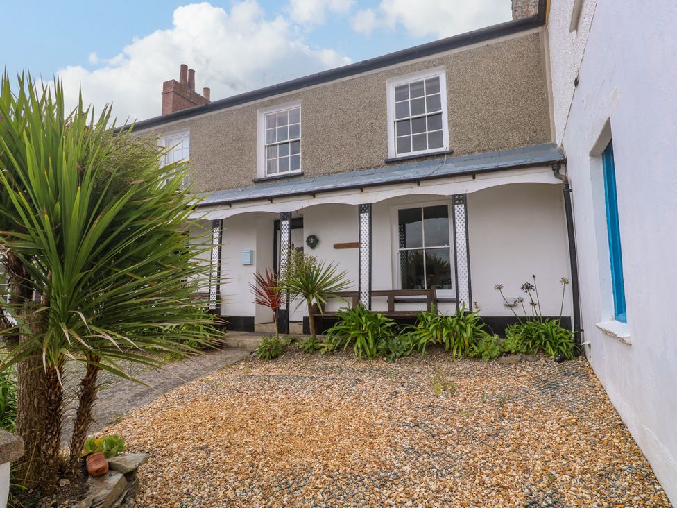 A house exterior with plants and gravel path at 1 Dormer Villas Portscatho