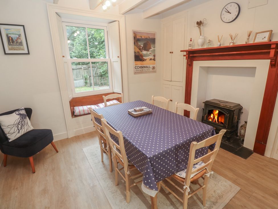 A dining room with a table and chairs at Banneth in Helford
