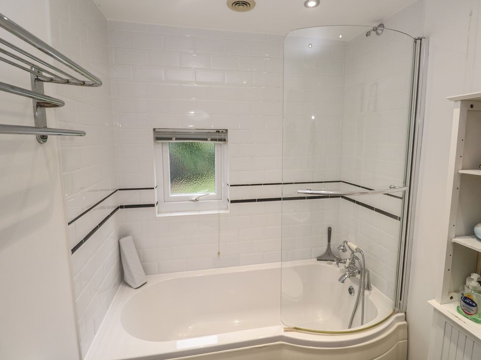 A bathroom with a bathtub and shower at Banneth in Helford