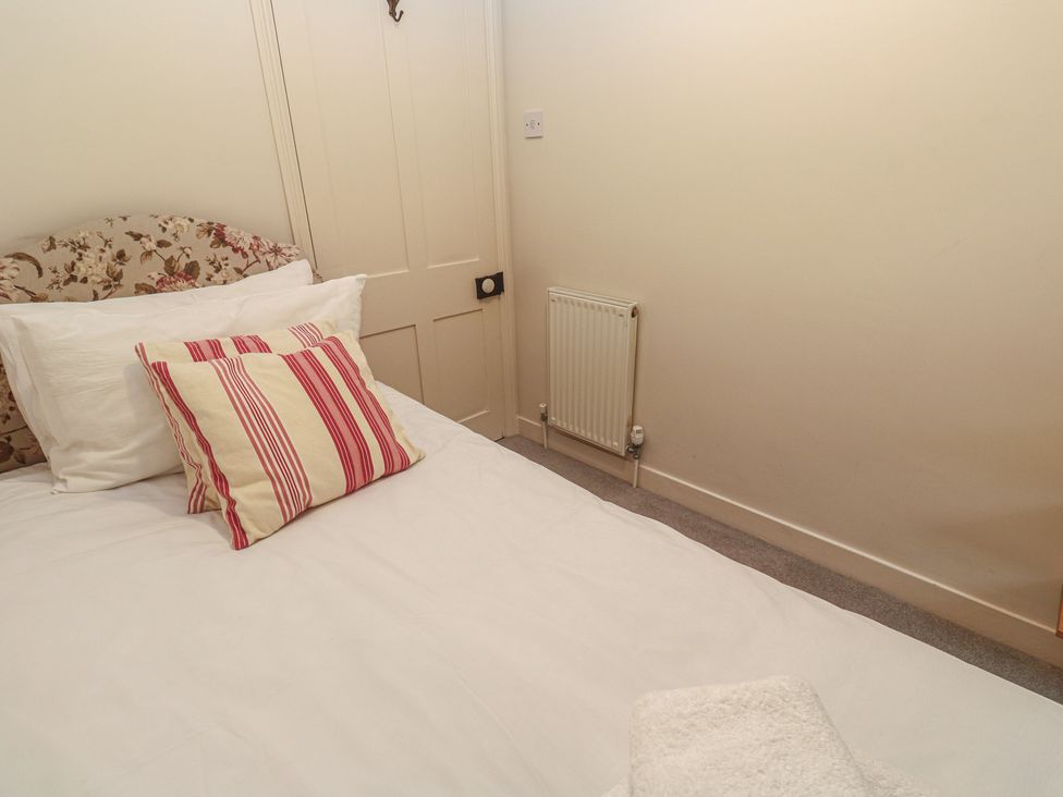 A bedroom with a bed and pillow at Banneth in Helford