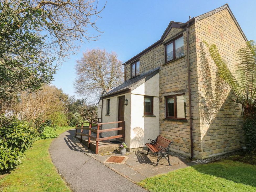 A house with a pathway and garden at Two Hoots in Falmouth