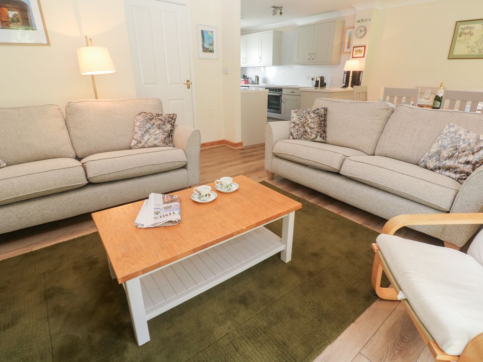 A living room with two sofas and a coffee table at Sild Cottage in Falmouth