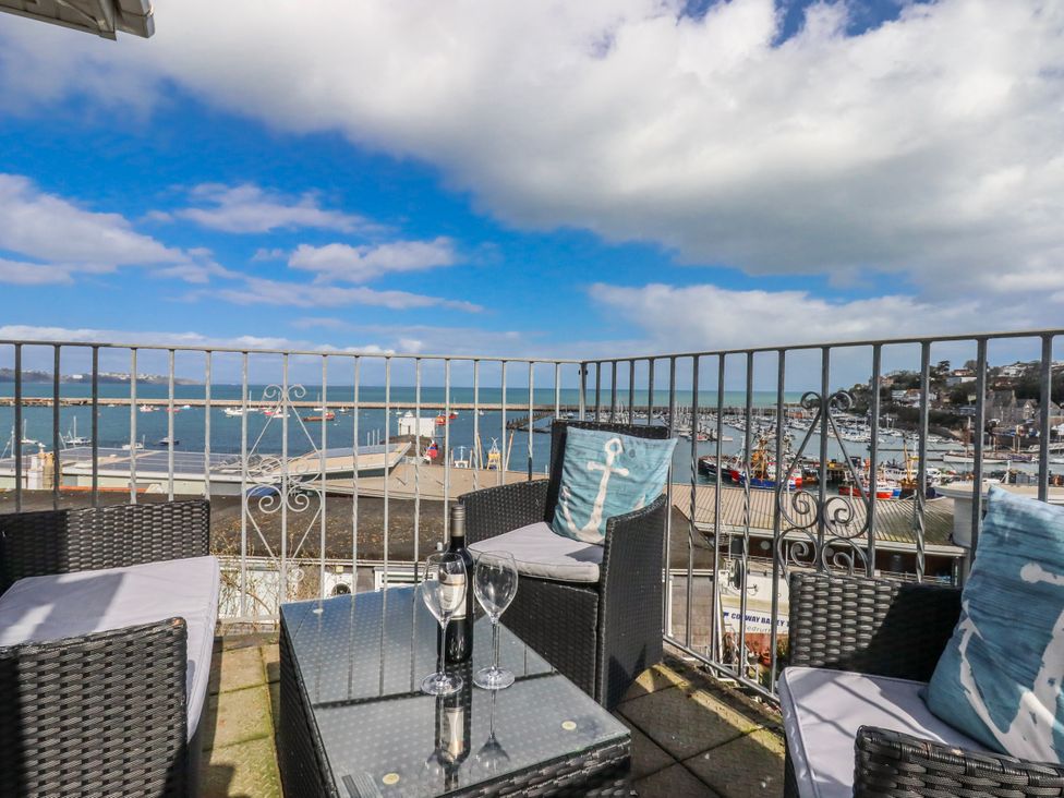 A seating area with views of the marina and sea at Blue Horizon in Brixham