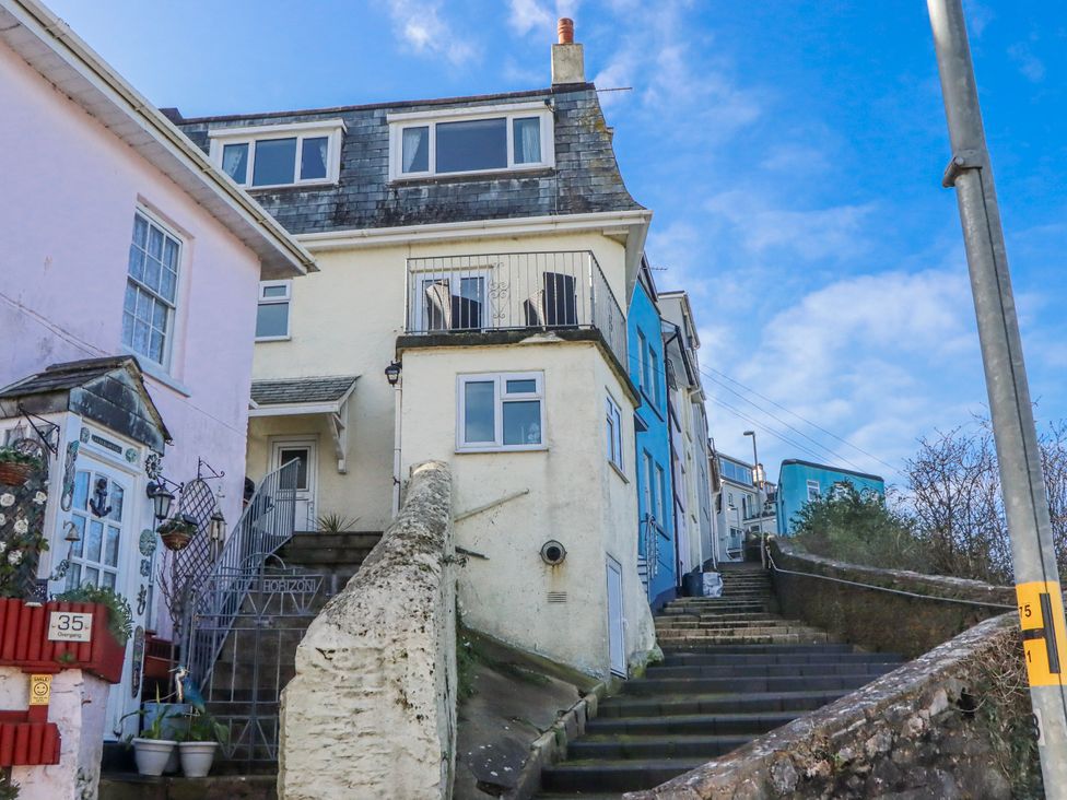 Houses and stairs leading to a balcony at Blue Horizon in Brixham