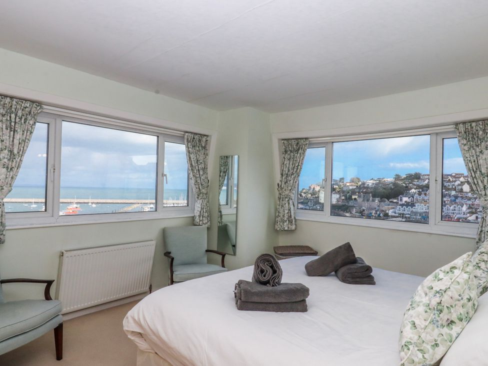 A bedroom with a bed and view at Blue Horizon in Brixham