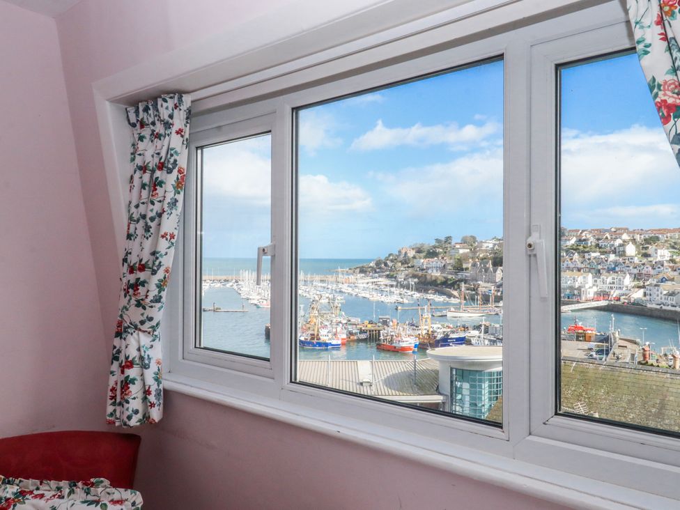 A window with a view of the harbor at Blue Horizon in Brixham