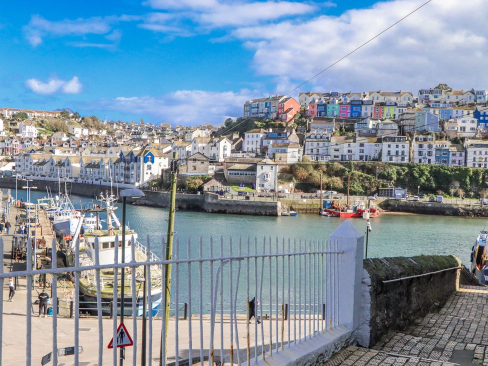 A view of a harbor with boats and colorful buildings at Blue Horizon in Brixham