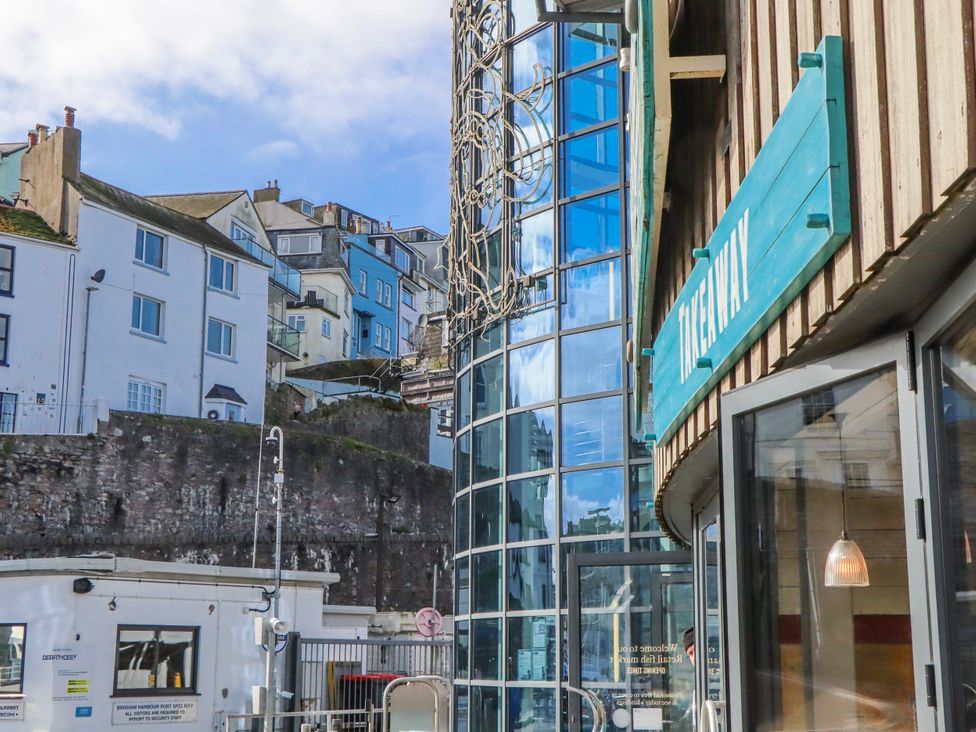 A view of buildings and a sign at Blue Horizon in Brixham