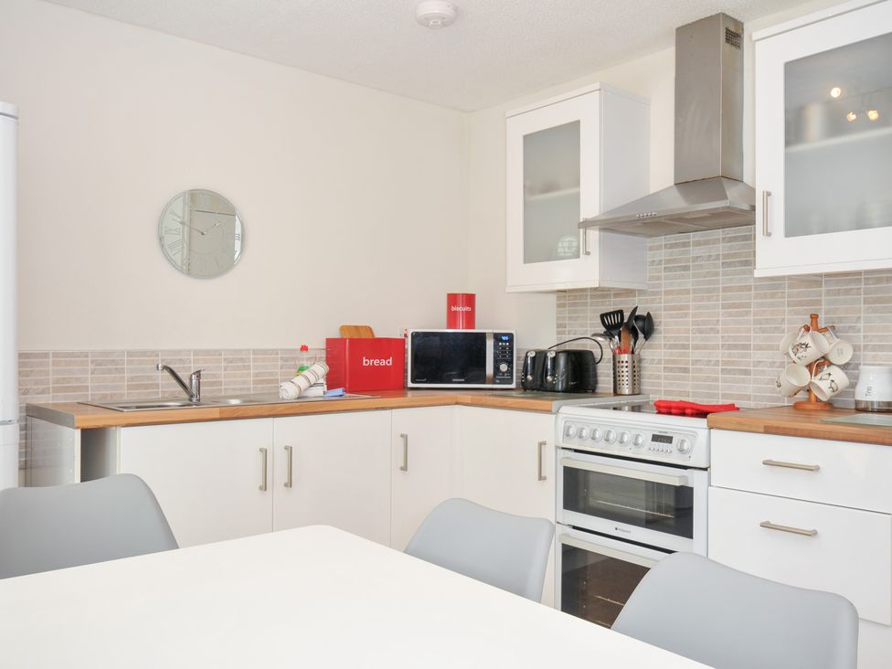 A kitchen with appliances and utensils at Manorcombe 2 Callington