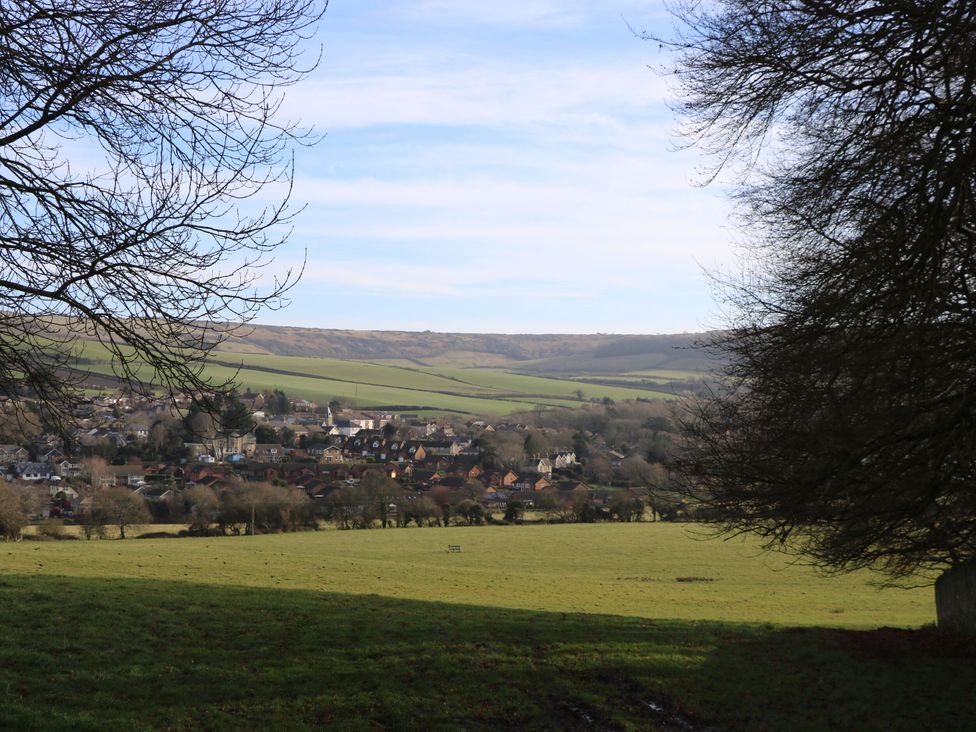 A view of a village surrounded by hills and fields at The Stable Cottage in Wroxall