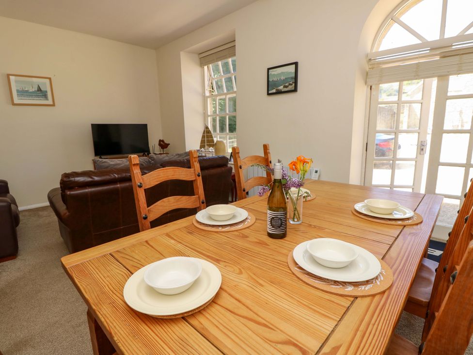 A dining room with a table and chairs at The Stable Cottage in Wroxall