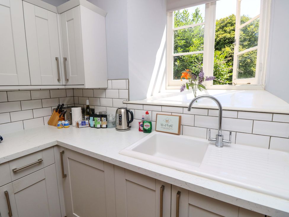 A kitchen with a sink and window at The Stable Cottage in Wroxall