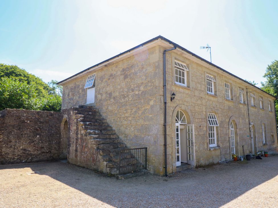 A building with stairs and windows at The Stable Cottage in Wroxall
