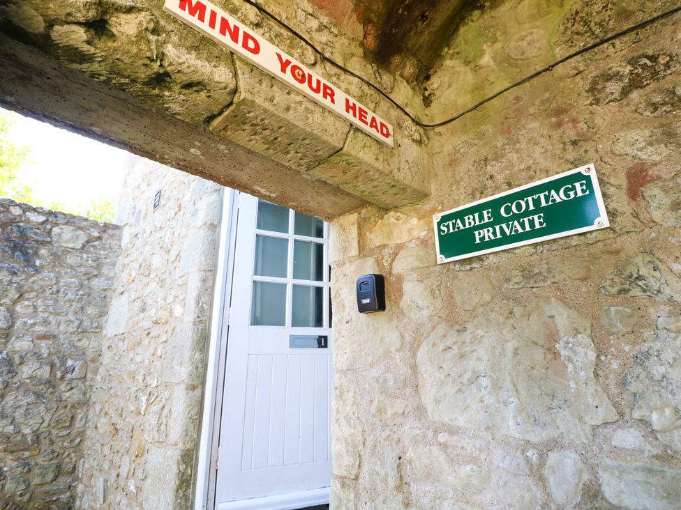 An entrance with a sign for Stable Cottage at The Stable Cottage in Wroxall