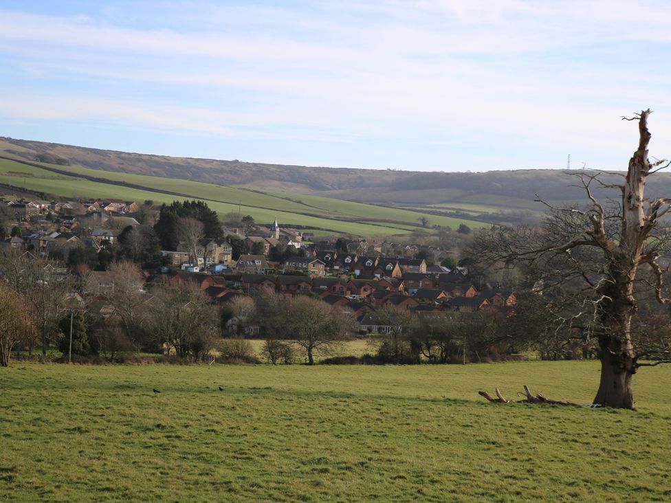 A landscape view of houses and fields at The Stable Cottage in Wroxall