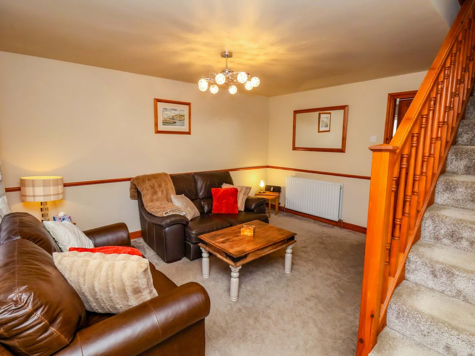 A living room with sofas and a coffee table at Eskview Cottage in Ruswarp near Whitby
