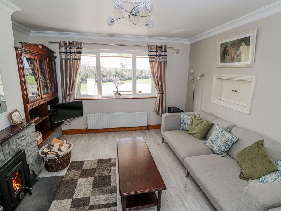 A living room with a sofa and coffee table at Castle View in Oughterard, County Galway