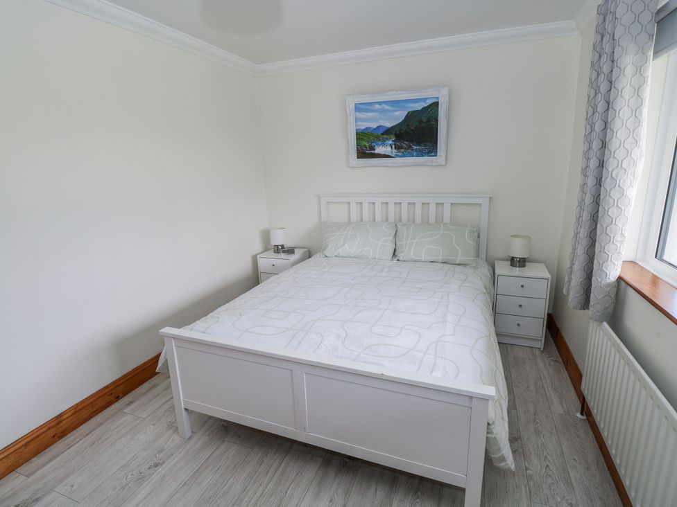 A bedroom featuring a bed and nightstand at Castle View in Oughterard, County Galway