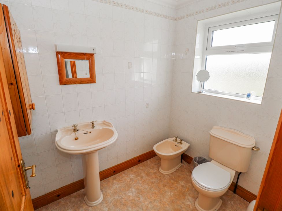 A bathroom with a sink, toilet, and bidet at Castle View, Oughterard, County Galway