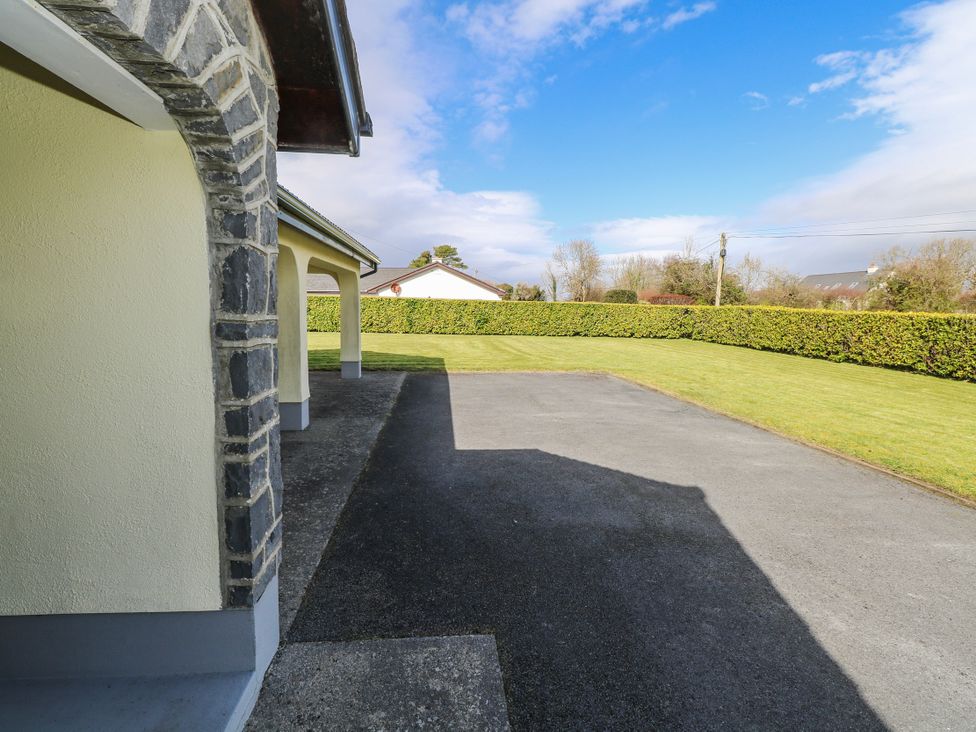 An outdoor view of a driveway and grassy area at Castle View in Oughterard, County Galway
