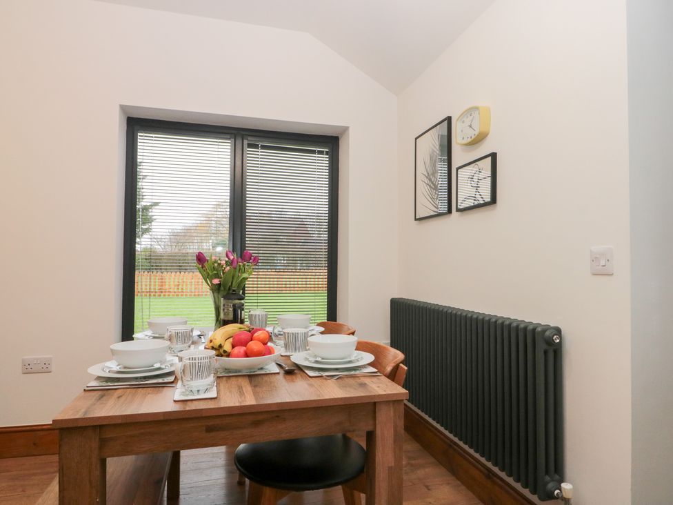A dining room with a table set for breakfast at Fieldside in Hunmanby