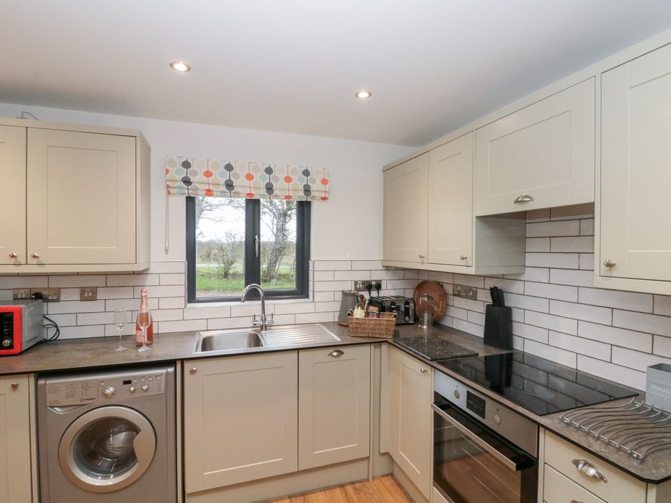 A kitchen with a sink and oven at Fieldside in Hunmanby