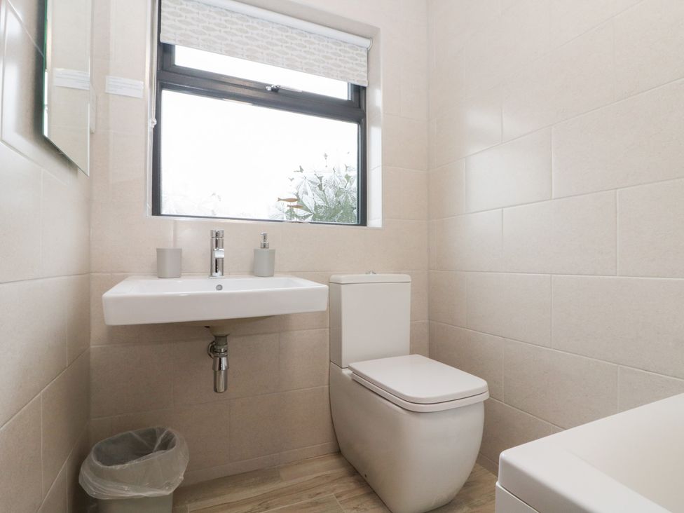 A bathroom with a sink and toilet at Fieldside in Hunmanby