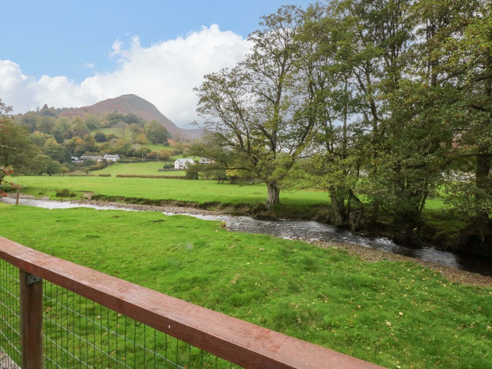 A view of a stream and mountain at River's Nook in Llangynog
