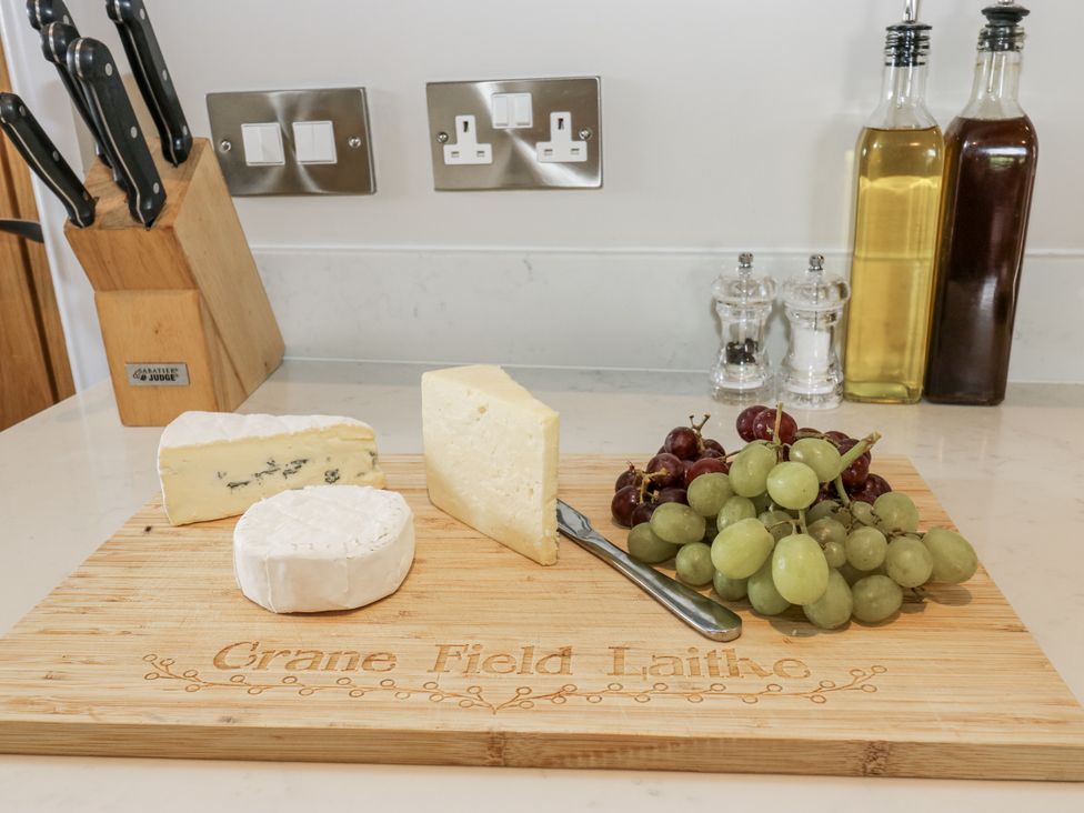 A cheese board with grapes and condiments at Crane Field Laithe in Otterburn, North Yorkshire